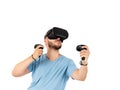 Young man playing with a virtual reality glasses on a white background