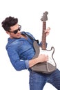 Young man plays electric guitar Royalty Free Stock Photo