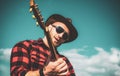 Young man plays guitar at sky. Royalty Free Stock Photo