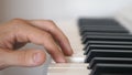 The young man plays a piano. Close up oh his hands Royalty Free Stock Photo