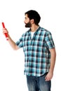 Young man pointing with big red pencil. Royalty Free Stock Photo