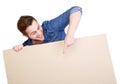 Young man pointing finger on blank poster sign Royalty Free Stock Photo