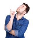 Young man pointing finger up Royalty Free Stock Photo