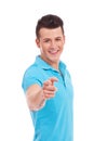 Young man pointing to you