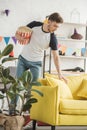 young man with popcorn basket in decorated living