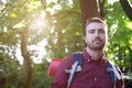 Young man portrait hiking in the forest