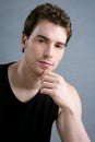 Young man portrait posing looking camera