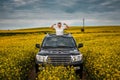 Young man posing in black car Royalty Free Stock Photo