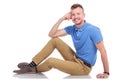 Young man posing on the floor Royalty Free Stock Photo