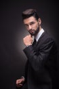 Young man posing handsome suit elegant, black background