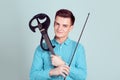 Young man holding violin and fiddlestick Royalty Free Stock Photo