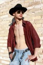 Young man posing next to a brick wall Royalty Free Stock Photo