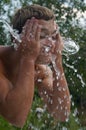 The young man poured water Royalty Free Stock Photo