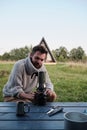 Young man pours coffee from a geyser coffee maker Royalty Free Stock Photo