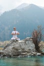 A young man practices yoga. Exercise Agni Stambhasana