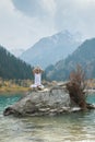 A young man practices yoga. Exercise Agni Stambhasana