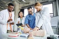 young man practicing chest compressions on Royalty Free Stock Photo