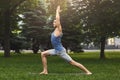 Young man practicing yoga outdoors Royalty Free Stock Photo