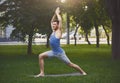 Young man practicing yoga outdoors Royalty Free Stock Photo