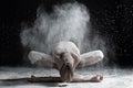 Young man practicing yoga, sitting in Garland exercise with forward bend, variation of Malasana pose