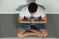 man practicing zen yoga near wall indoors, above view Royalty Free Stock Photo