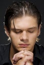 Young man praying Royalty Free Stock Photo