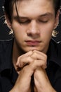 Young man praying Royalty Free Stock Photo