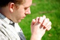 Young man praying Royalty Free Stock Photo