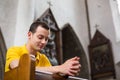 Young man praying in a church Royalty Free Stock Photo