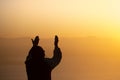 Young man praying in the morning, Hands folded in prayer concept for faith, spirituality and religion