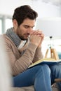 young man praying on wooden bible at home Royalty Free Stock Photo