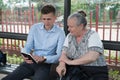 Young man preaching to an old woman Royalty Free Stock Photo