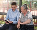 Young man preaching to an old woman Royalty Free Stock Photo