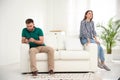 Man preferring smartphone over his girlfriend at home. Relationship problems