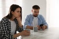 Man preferring smartphone over his girlfriend at home. Relationship problems