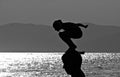 A young man prepares to take a dive into the Sea of Japan in Vladivostok - Russia -