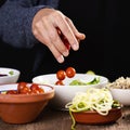 Young man preparing a buddha bowl salad Royalty Free Stock Photo