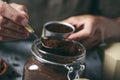 Young man preparing coffee in a moka pot