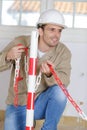 young man preparing crane hook to lifting materials Royalty Free Stock Photo