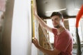 Young man doing apartment repair hisselfes Royalty Free Stock Photo