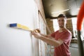 Young man doing apartment repair hisselfes Royalty Free Stock Photo