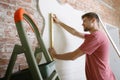 Young man doing apartment repair hisselfes Royalty Free Stock Photo