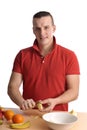 Young man preparing a fruit salad