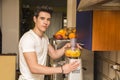 Young man preparing healthy fruit smoothie Royalty Free Stock Photo