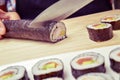 Young man preparing makizushi