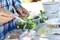 Young man preparing a prepared salad Royalty Free Stock Photo