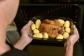 Young man preparing a roast turkey Royalty Free Stock Photo