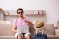 Young man preparing for trip at home Royalty Free Stock Photo