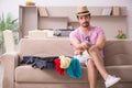 Young man preparing for trip at home Royalty Free Stock Photo