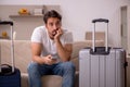 Young man preparing for trip at home Royalty Free Stock Photo
